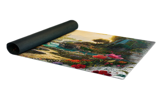 A rectangular mat with a detailed landscape print, partially unrolled from a black rolled-up end